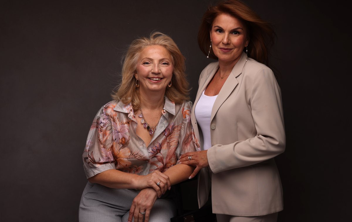 Two women in conversation, one fully present and listening, at NutritiousDr