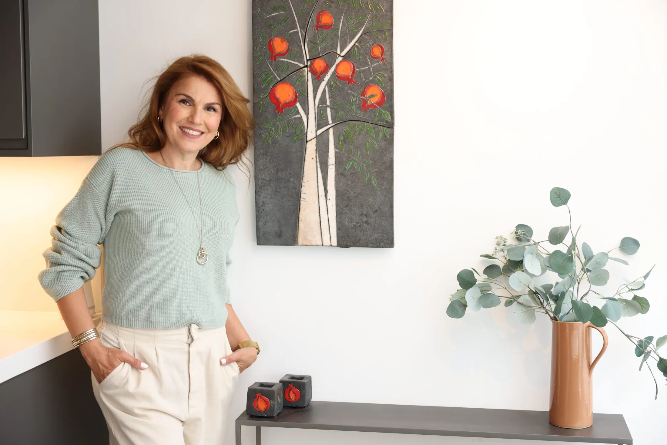 Dr. BB Beba with pomegranate, looking past “normal” hormone ranges